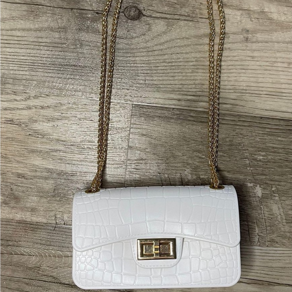 White bag with gold chain